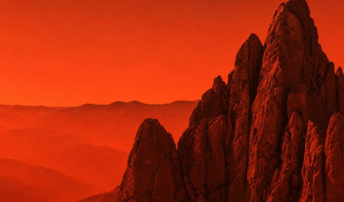 Biennale del Gran Sasso, veduta artistica orizzontale delle rocce del massiccio in tonalità rosse