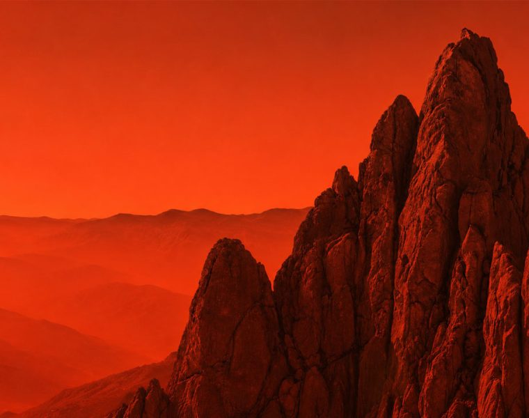 Biennale del Gran Sasso, veduta artistica orizzontale delle rocce del massiccio in tonalità rosse